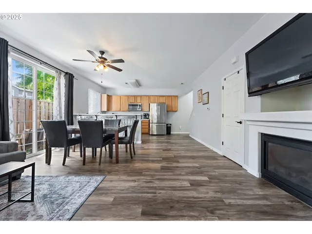 a view of a livingroom with furniture window and wooden floor