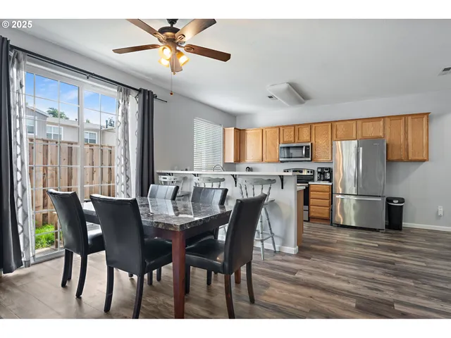 a view of a dining room with furniture window and outside view