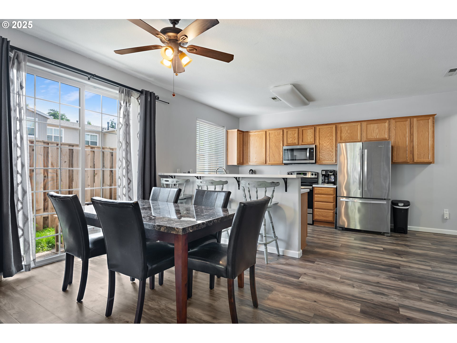 6255 Southwest 182nd Terrace Beaverton, OR 97007 - Photo 14 of 42 a view of a dining room with furniture window and outside view