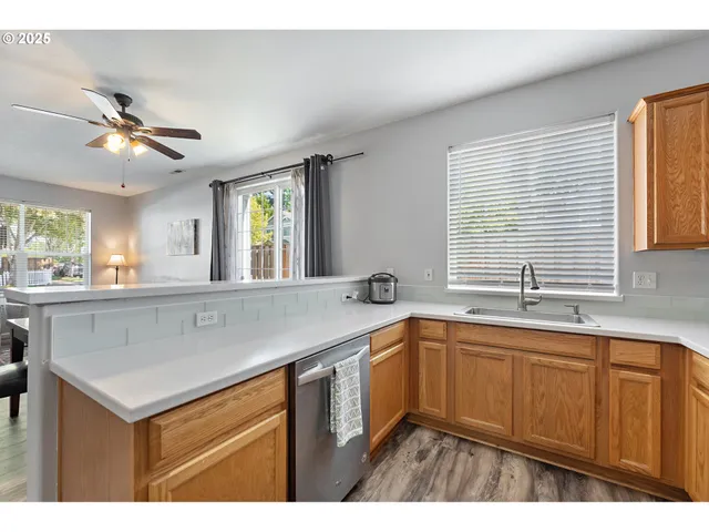 a open kitchen with sink cabinets and wooden floor