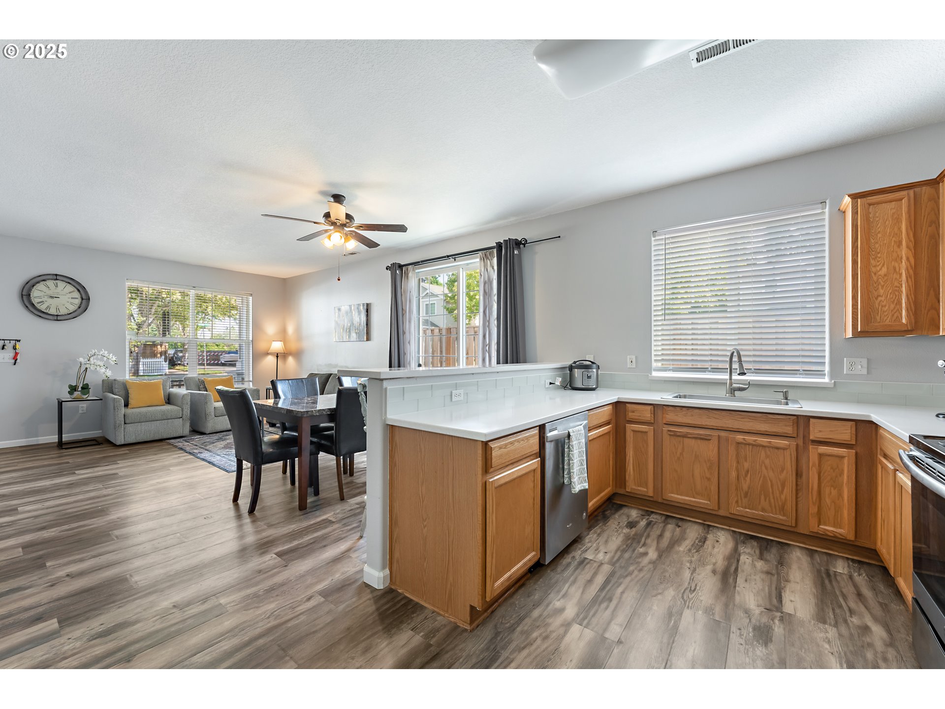 6255 Southwest 182nd Terrace Beaverton, OR 97007 - Photo 22 of 42 a open kitchen with sink cabinets and wooden floor
