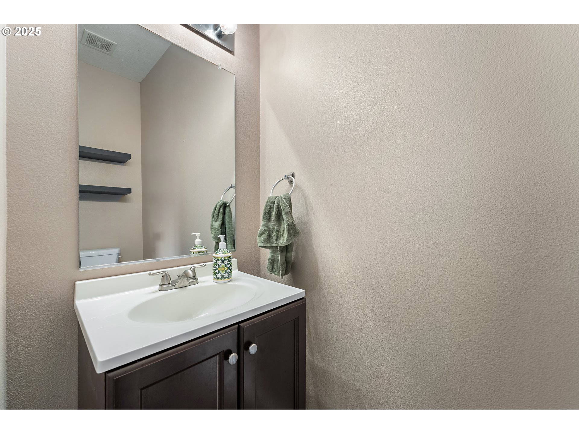 6255 Southwest 182nd Terrace Beaverton, OR 97007 - Photo 23 of 42 a bathroom with a sink and a mirror