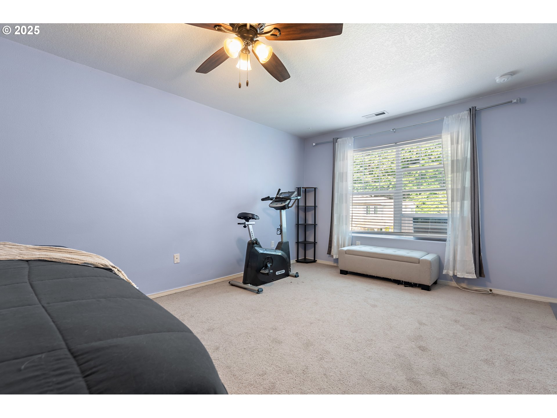 6255 Southwest 182nd Terrace Beaverton, OR 97007 - Photo 25 of 42 a room with gym equipment and a large window