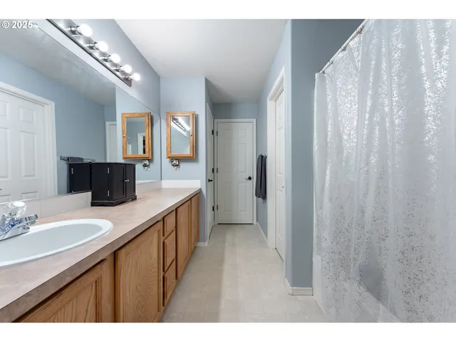 a kitchen with a refrigerator and a sink