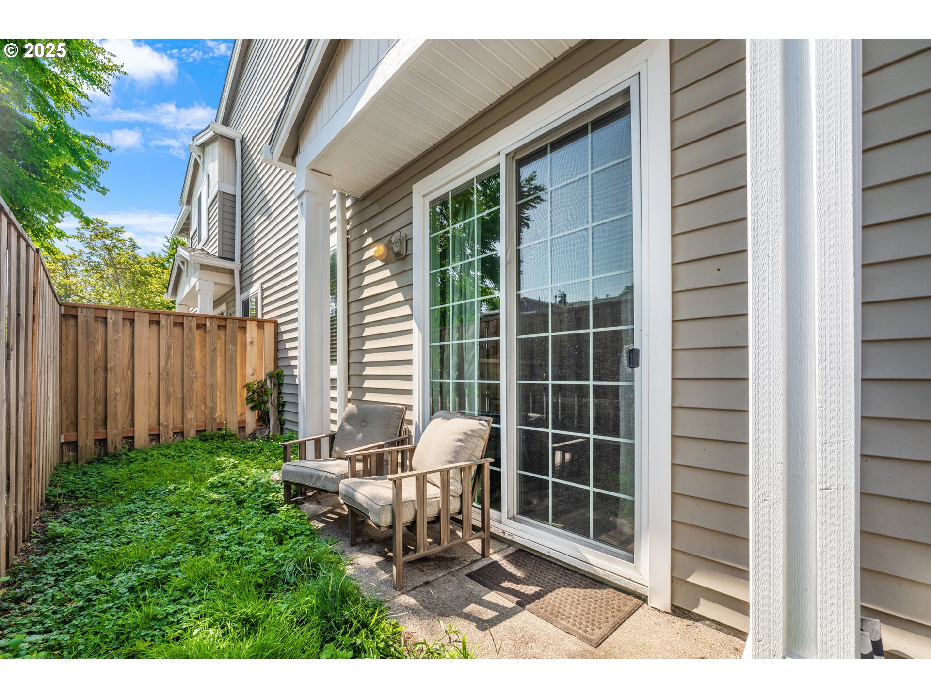 6255 Southwest 182nd Terrace Beaverton, OR 97007 - Photo 37 of 42 a balcony with table and chairs and potted plants
