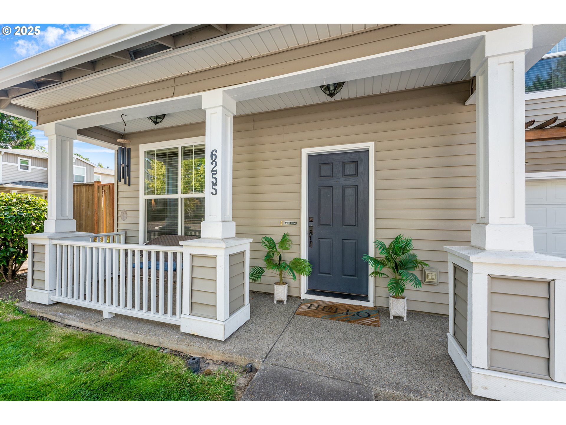 6255 Southwest 182nd Terrace Beaverton, OR 97007 - Photo 4 of 42 a view of a house with a small yard and wooden floor and fence