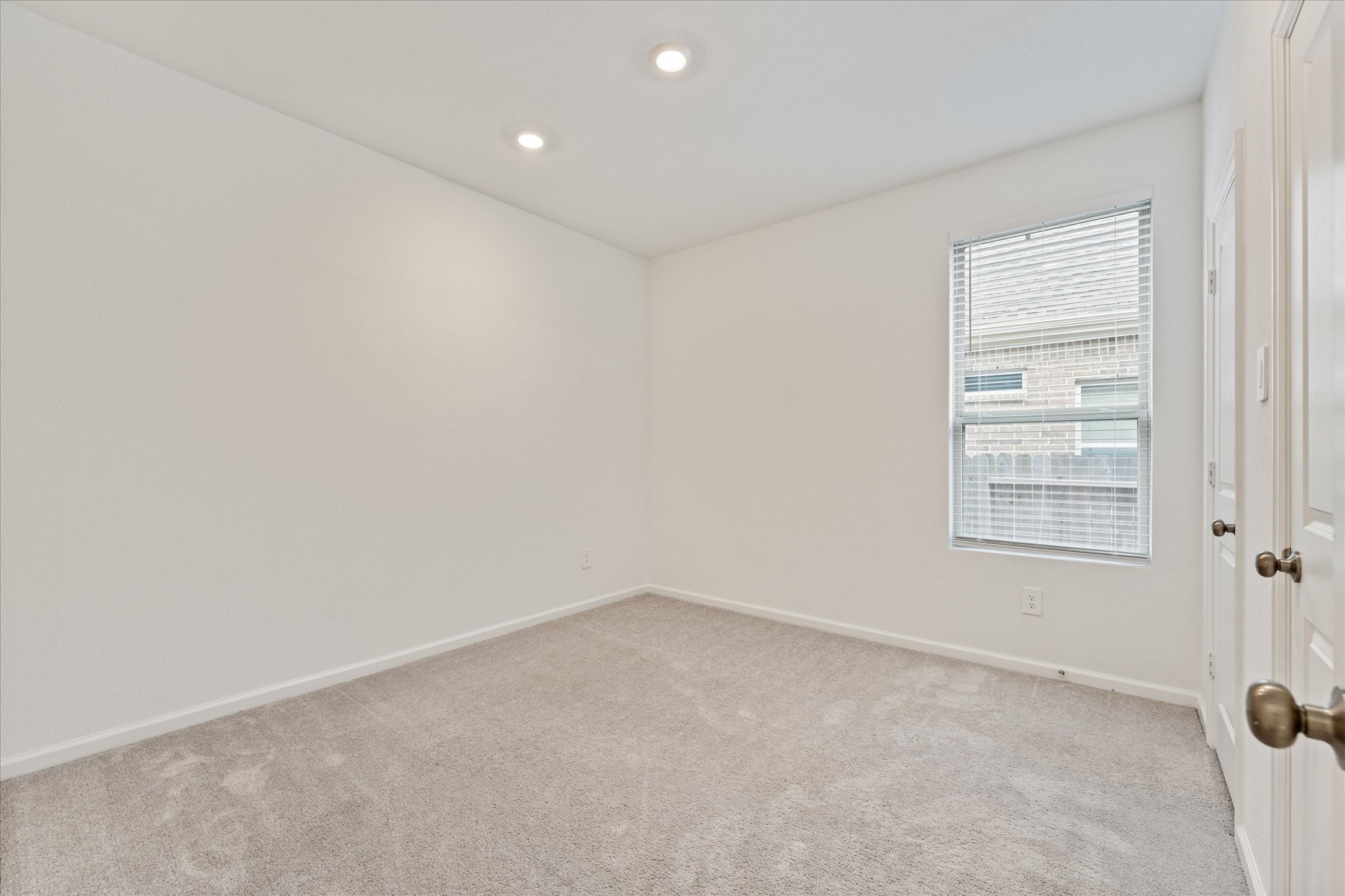 15520 Sunset Maple Court Conroe, TX 77302 - Photo 24 of 46 an empty room with a window