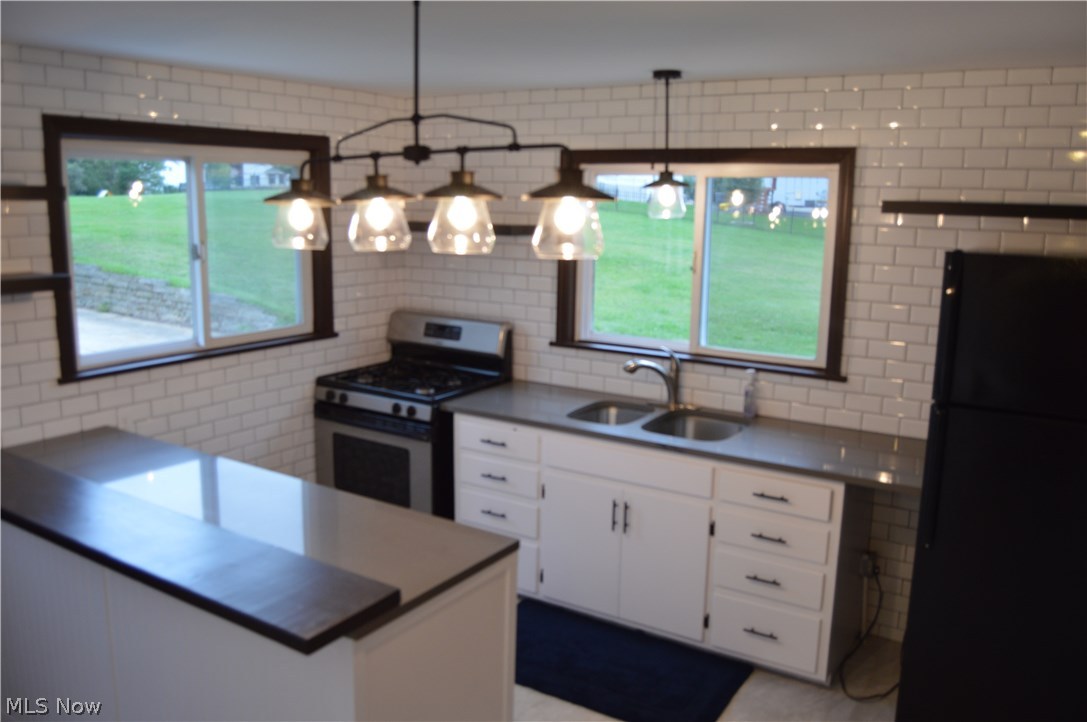 Upgraded kitchen with new counter tops, lighting, ceramic floors and more.