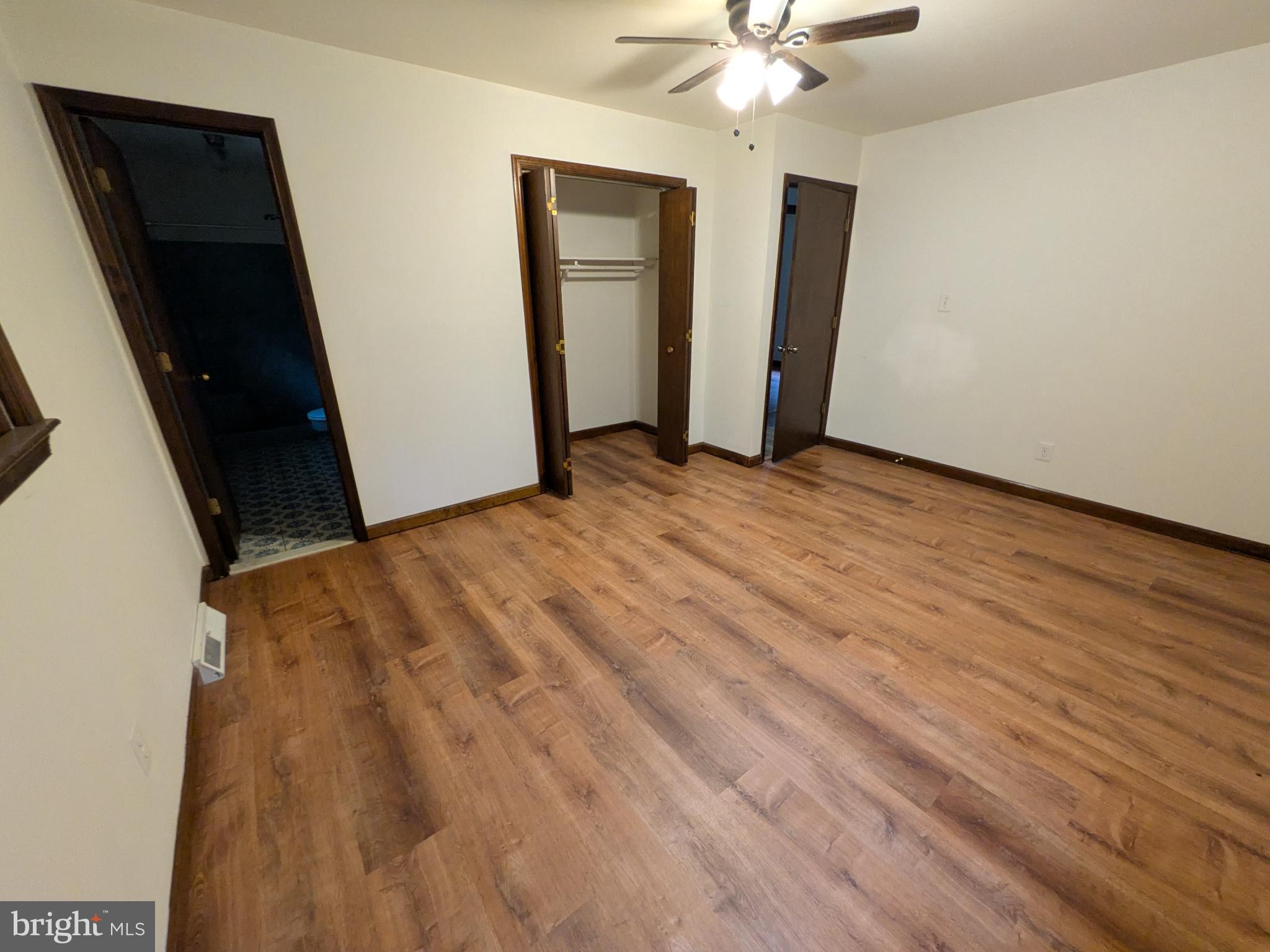 9511 Rogues Road Midland, VA 22728 - Photo 15 of 34 Spacious room with warm wood flooring.