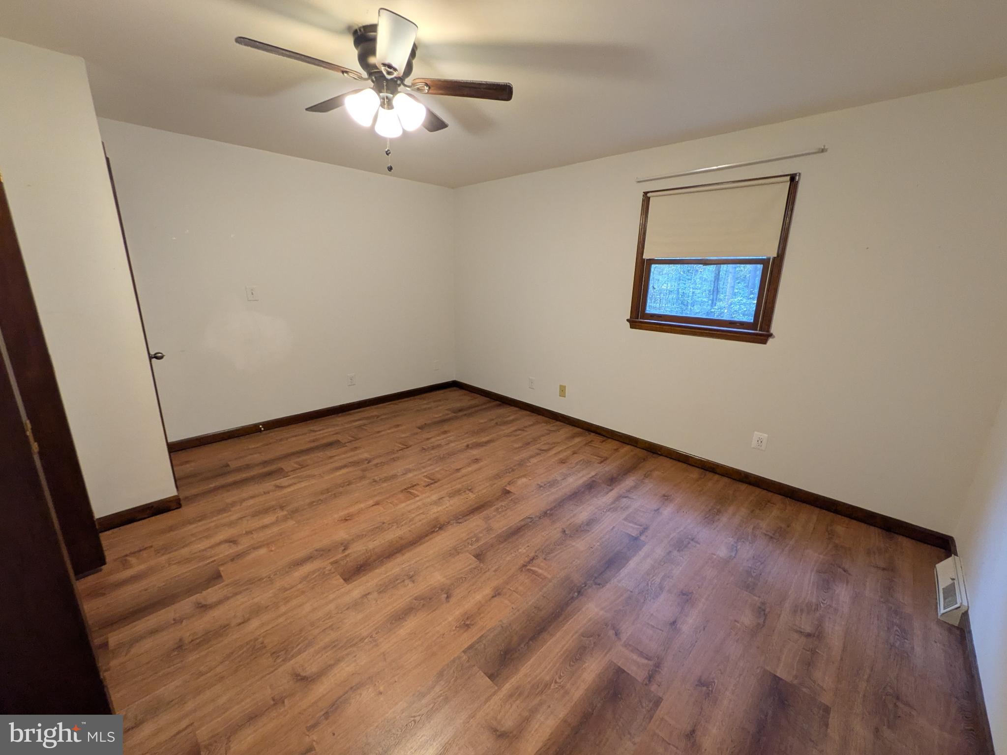 9511 Rogues Road Midland, VA 22728 - Photo 16 of 34 Spacious room with warm wood flooring.
