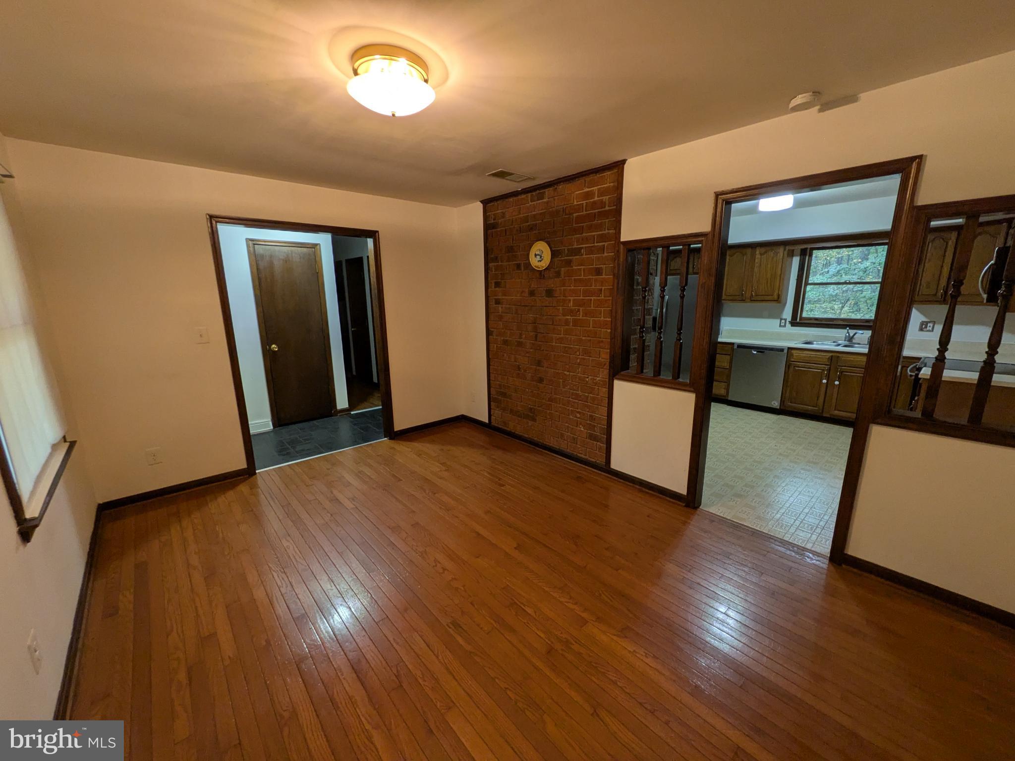 9511 Rogues Road Midland, VA 22728 - Photo 6 of 34 Spacious living area with warm wood accents.