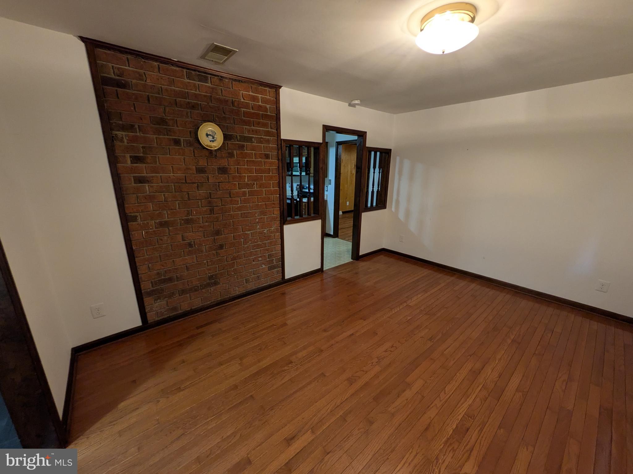 9511 Rogues Road Midland, VA 22728 - Photo 7 of 34 Spacious room with warm wooden floors.