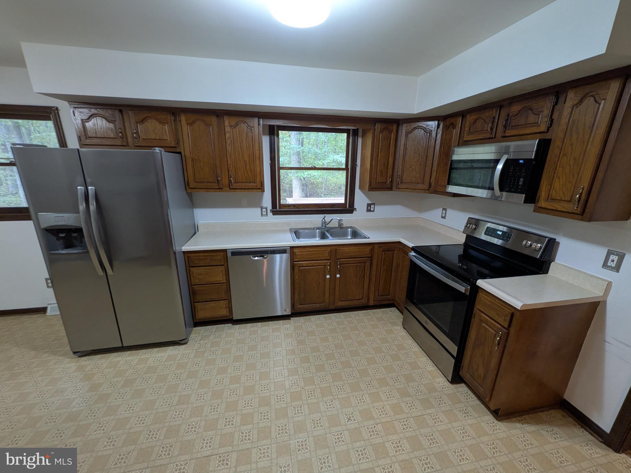 9511 Rogues Road Midland, VA 22728 - Photo 9 of 34 Modern kitchen with warm wood accents.
