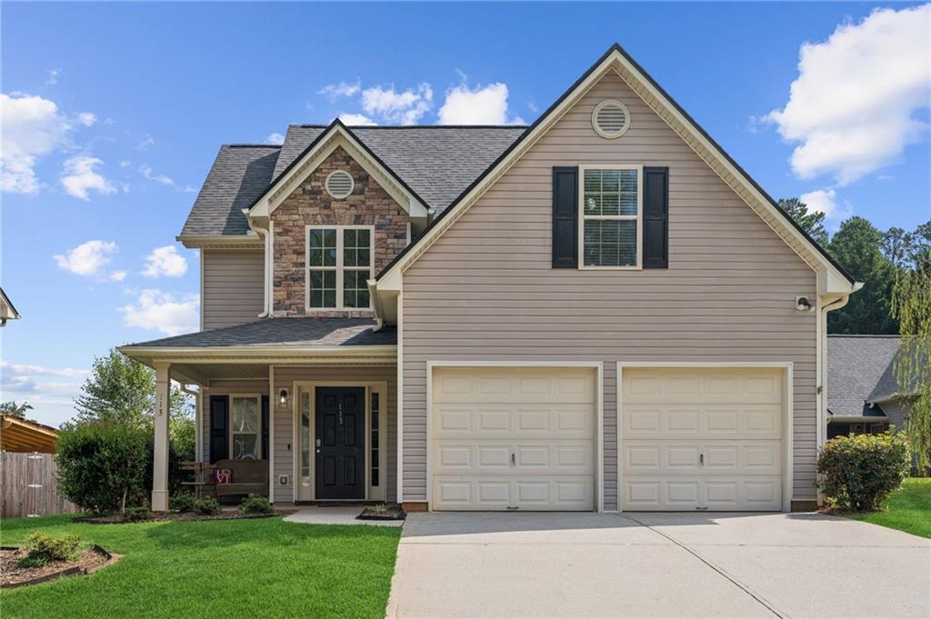 113 Sandberg Way Dawsonville, GA 30534 - Photo 1 of 1 a view of a house with a yard and garage