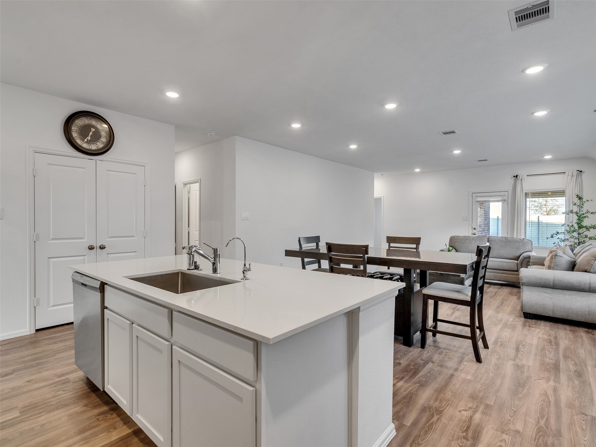 3019 Live Spgs Way Rosenberg, TX 77471 - Photo 13 of 36 a kitchen with a sink and chairs