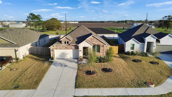 an aerial view of a house with a swimming pool