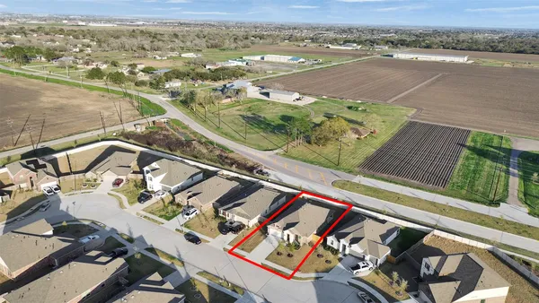 a view of a tennis ground with a large window