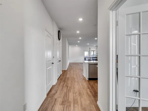a view of a kitchen from the hallway