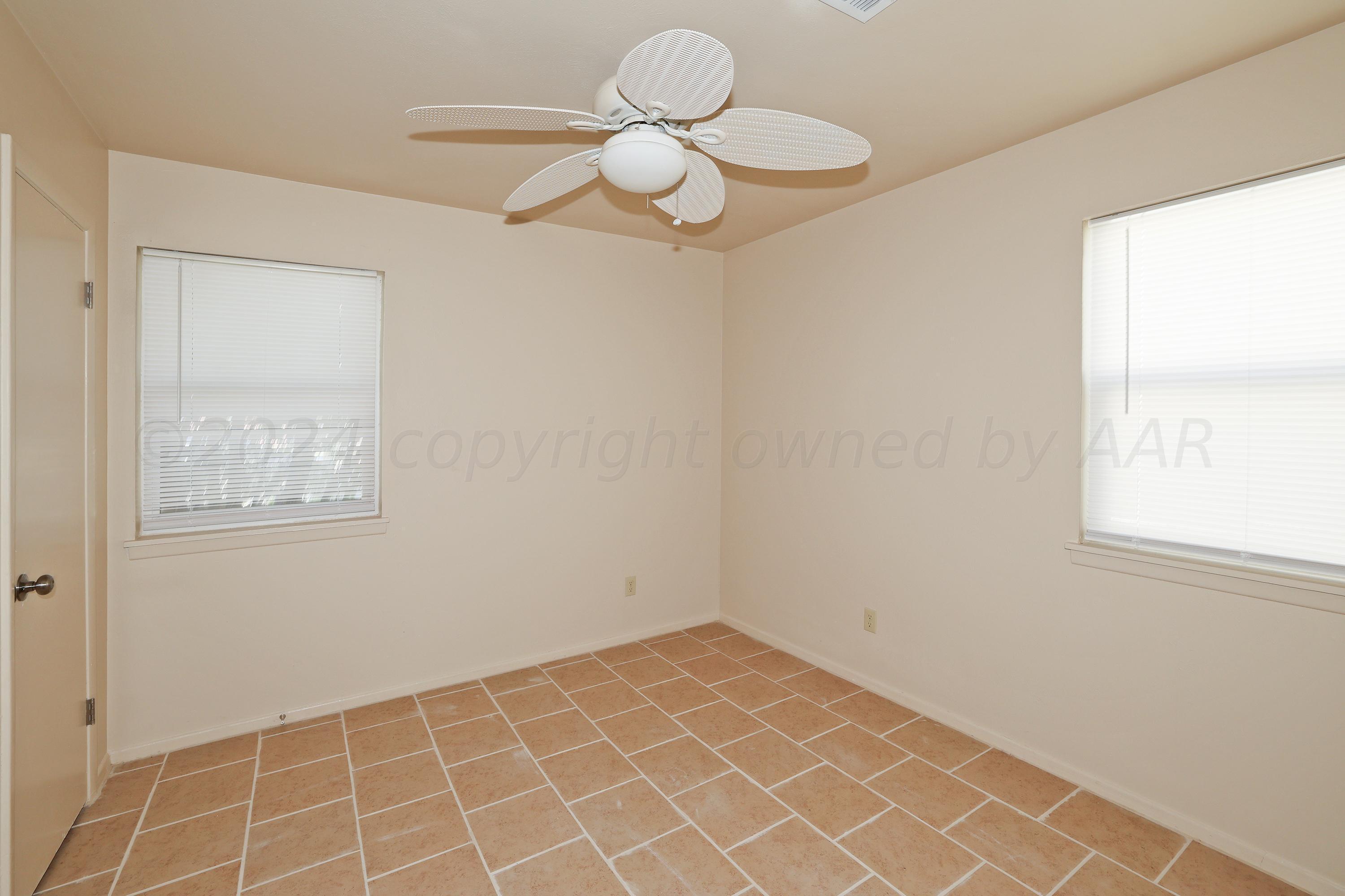 1232 Sycamore Avenue Amarillo, TX 79107 - Photo 13 of 19 a view of an empty room with a window