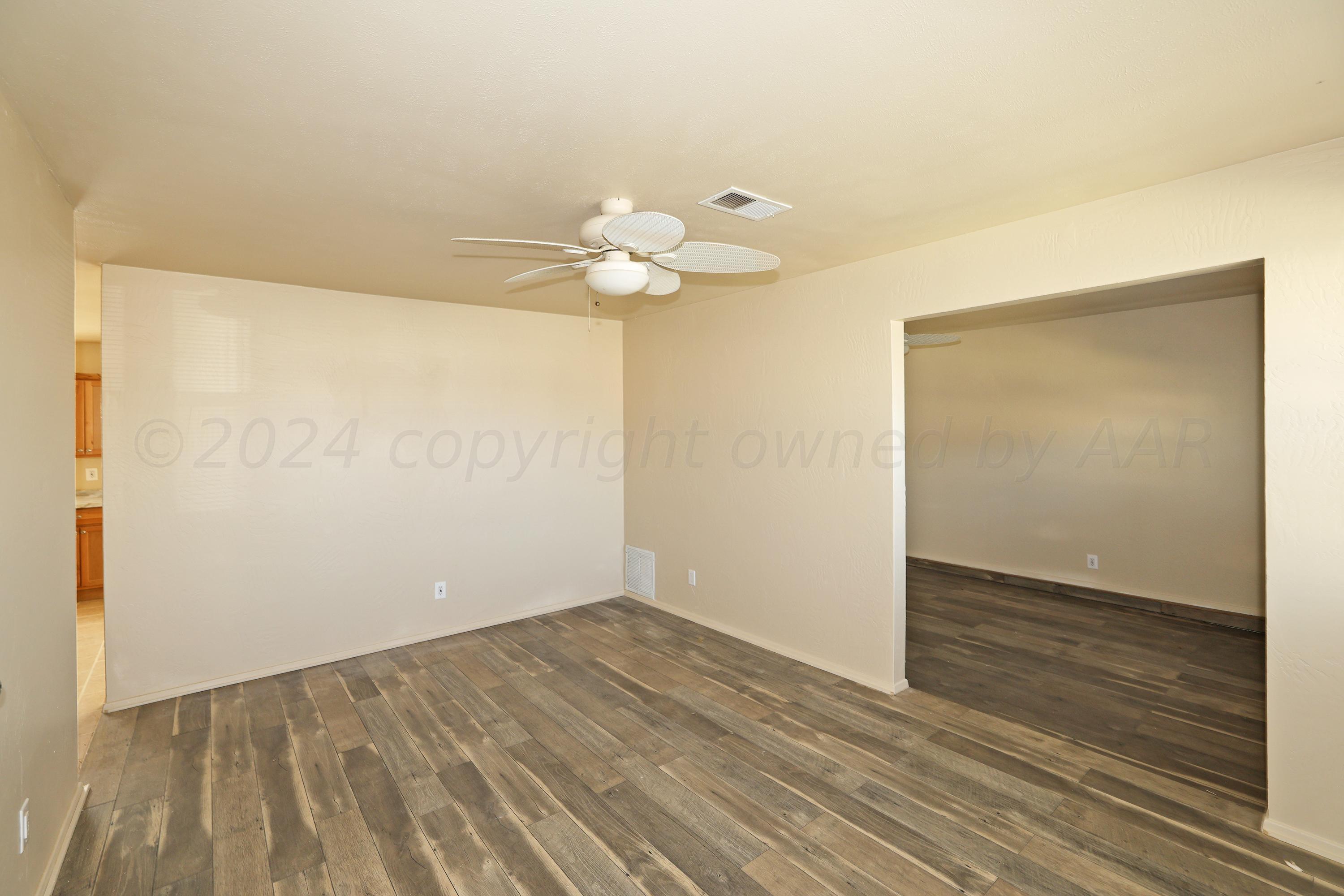 1232 Sycamore Avenue Amarillo, TX 79107 - Photo 2 of 19 wooden floor in an empty room