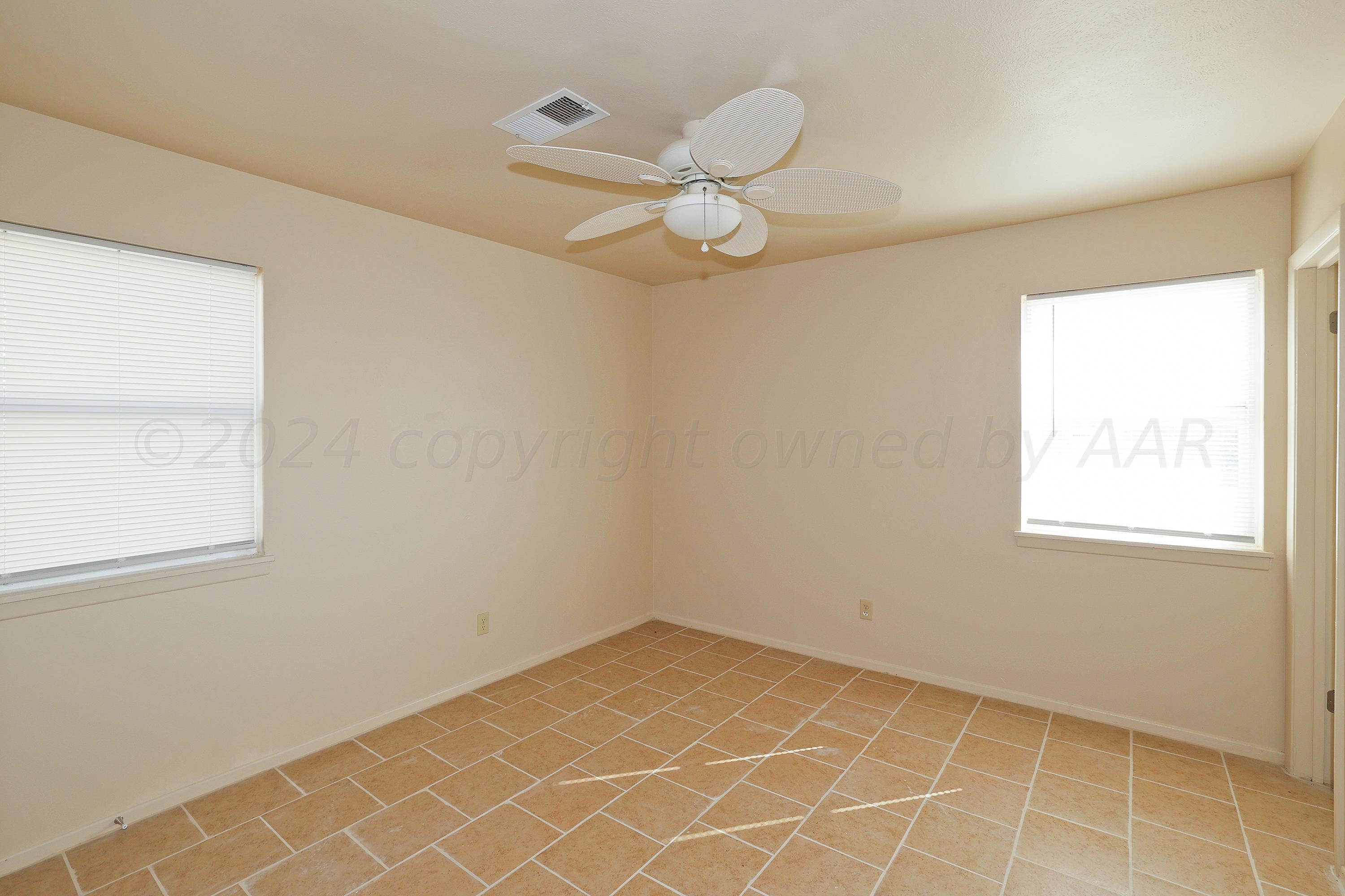 1232 Sycamore Avenue Amarillo, TX 79107 - Photo 10 of 19 an empty room with a window