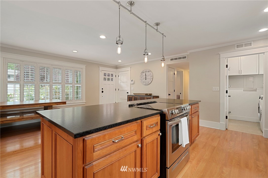 18 218th Place Southeast Bothell, WA 98021 - Photo 14 of 34 a kitchen with stainless steel appliances granite countertop a sink a stove and a refrigerator