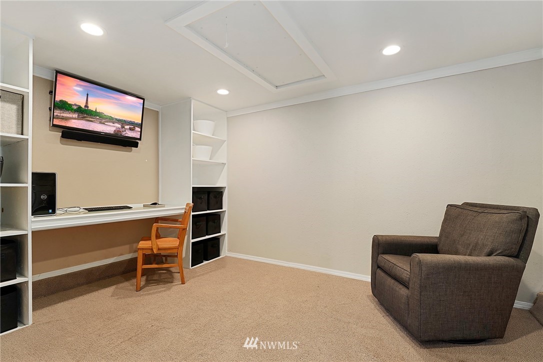 18 218th Place Southeast Bothell, WA 98021 - Photo 23 of 34 a living room with furniture a flat screen tv and a lamp
