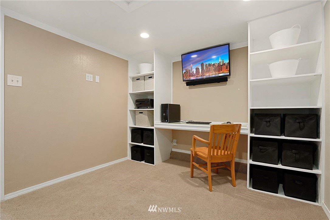 18 218th Place Southeast Bothell, WA 98021 - Photo 24 of 34 a room with furniture and a flat screen tv