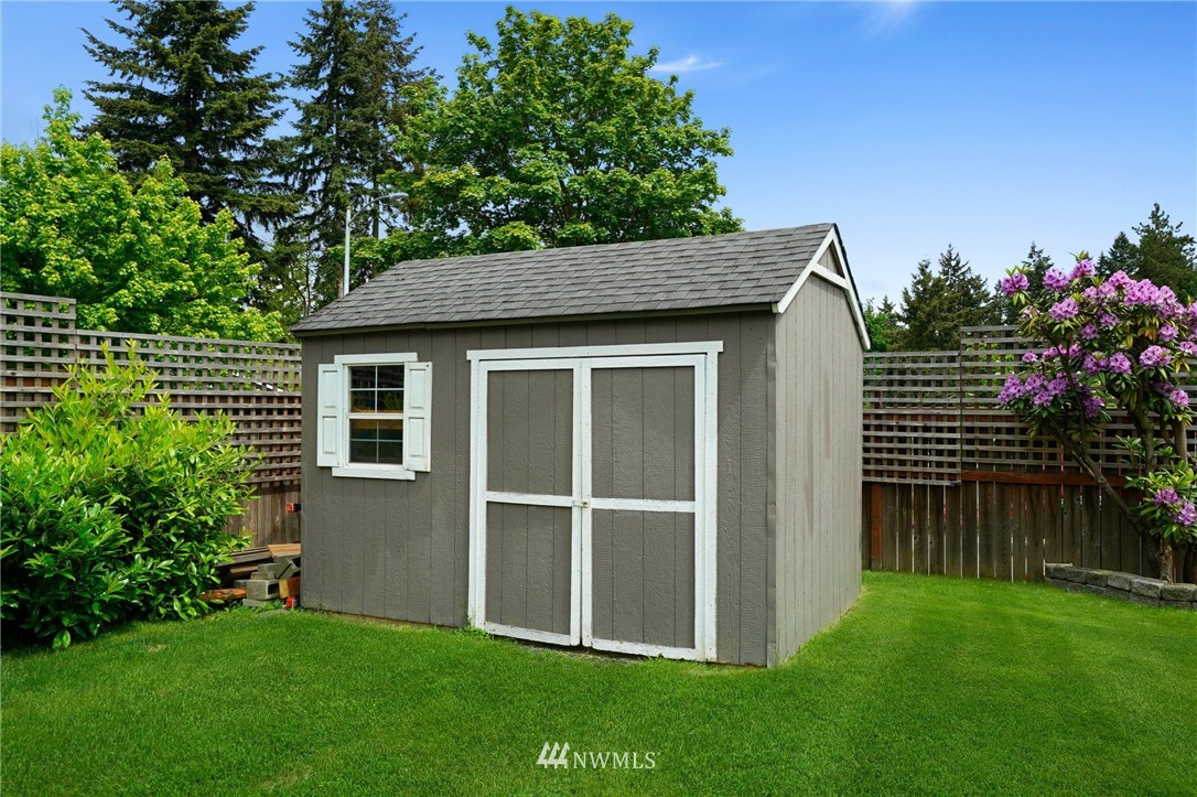 18 218th Place Southeast Bothell, WA 98021 - Photo 29 of 34 a view of a house with a yard