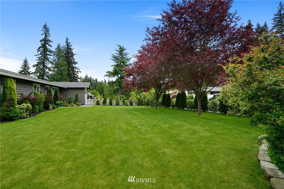 18 218th Place Southeast Bothell, WA 98021 - Photo 31 of 34 a view of a house with a yard