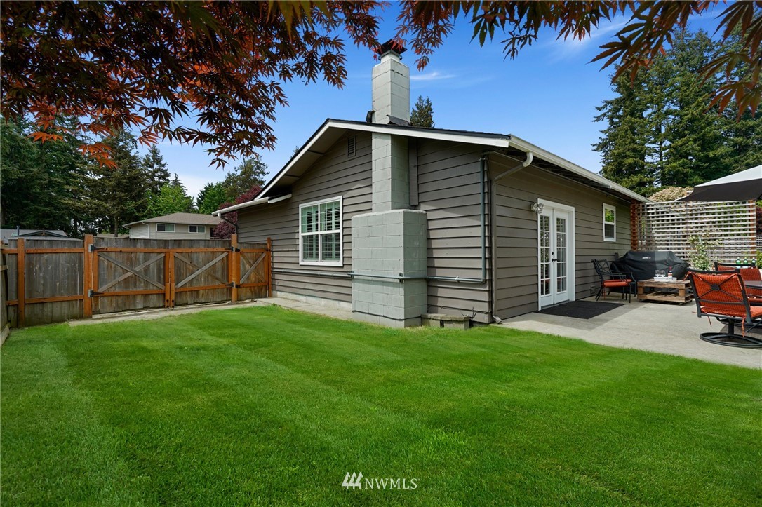 18 218th Place Southeast Bothell, WA 98021 - Photo 33 of 34 a view of a house with a yard and sitting area