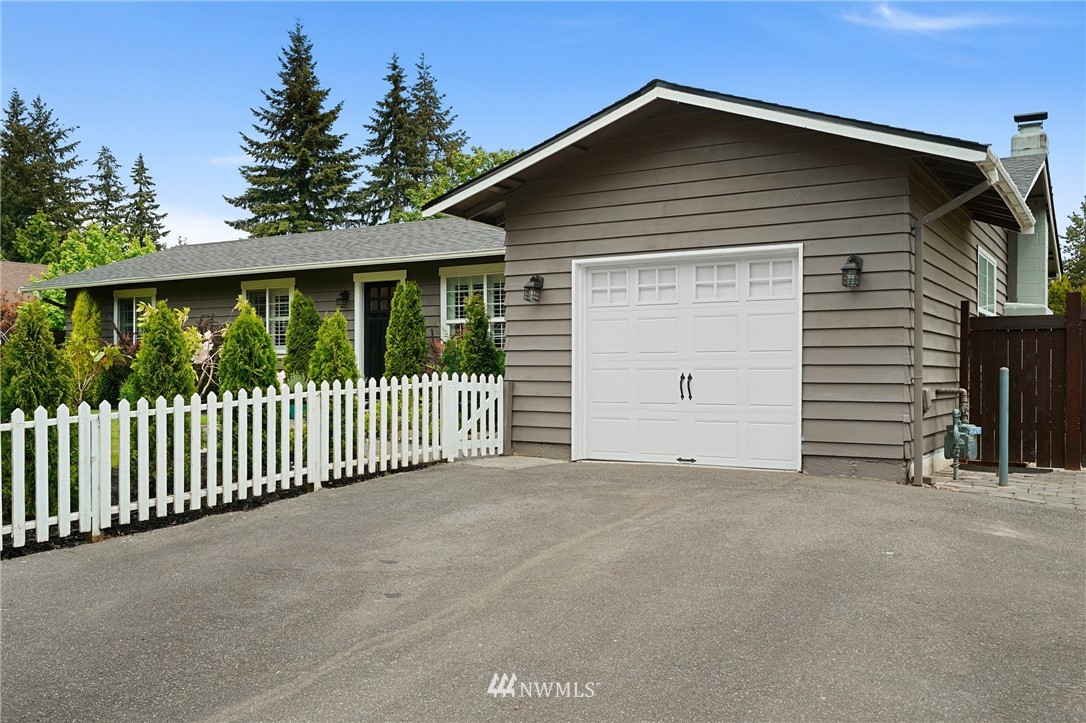 18 218th Place Southeast Bothell, WA 98021 - Photo 34 of 34 a view of a house with a small yard and wooden fence