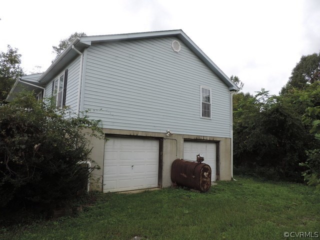 2299 Lockett Road Rice, VA 23966 - Photo 4 of 25 a front view of a house with a garden and parking space