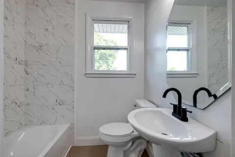 a bathroom with a sink and a toilet