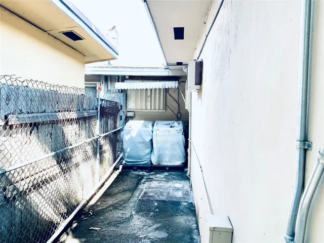 a view of balcony with wooden floor and seating space