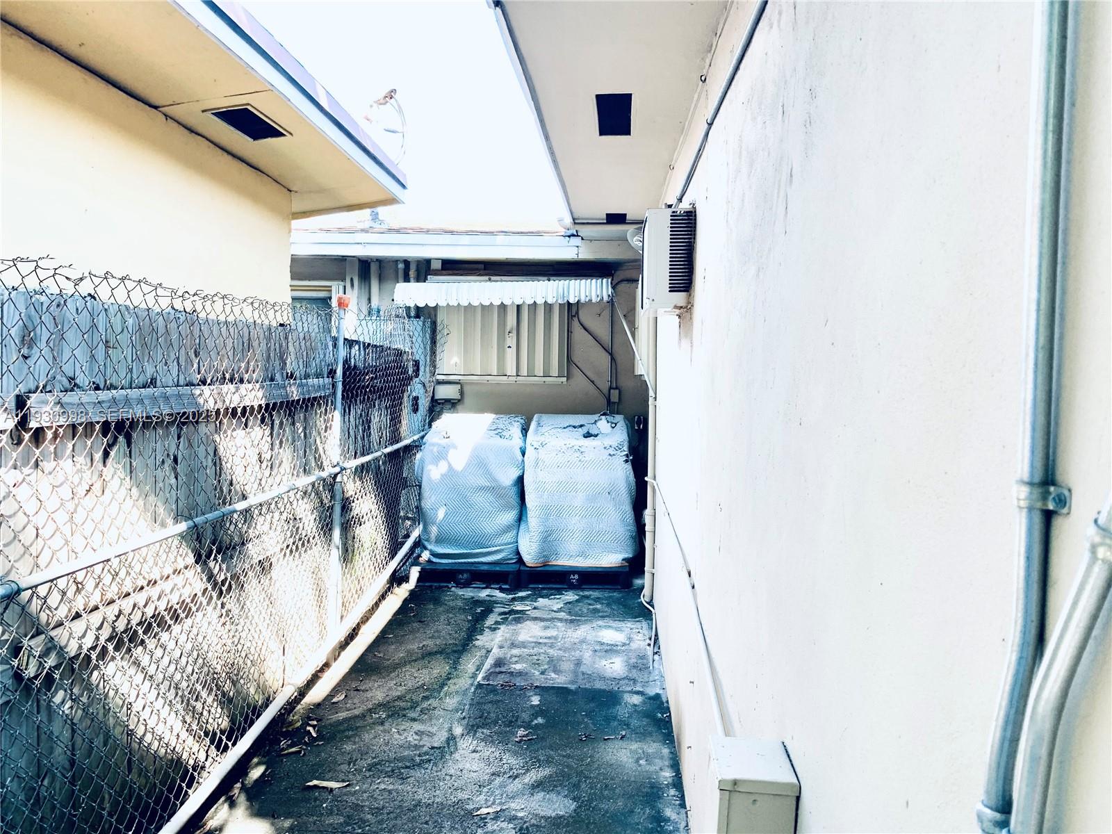 2814 Southwest 7th Street, Unit 2814 Miami, FL 33135 - Photo 13 of 13 a view of balcony with wooden floor and seating space
