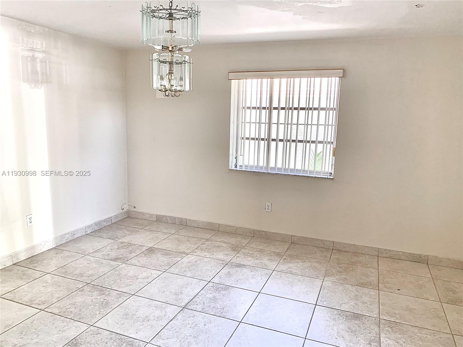 2814 Southwest 7th Street, Unit 2814 Miami, FL 33135 - Photo 3 of 13 an empty room with windows