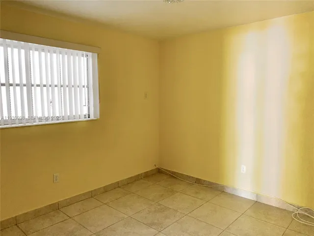 a view of a room with a window