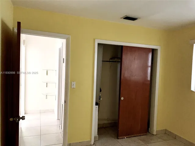 a view of a hallway with a door