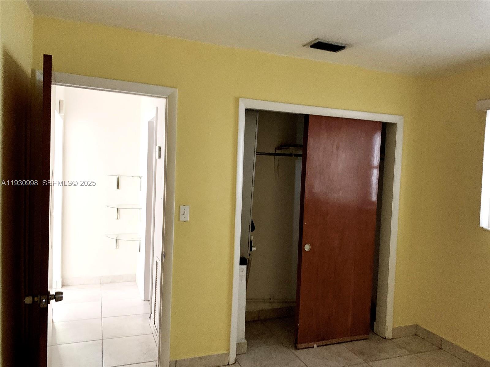 2814 Southwest 7th Street, Unit 2814 Miami, FL 33135 - Photo 9 of 13 a view of a hallway with a door