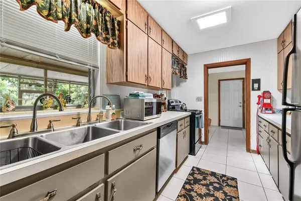 a kitchen that has a lot of cabinets in it