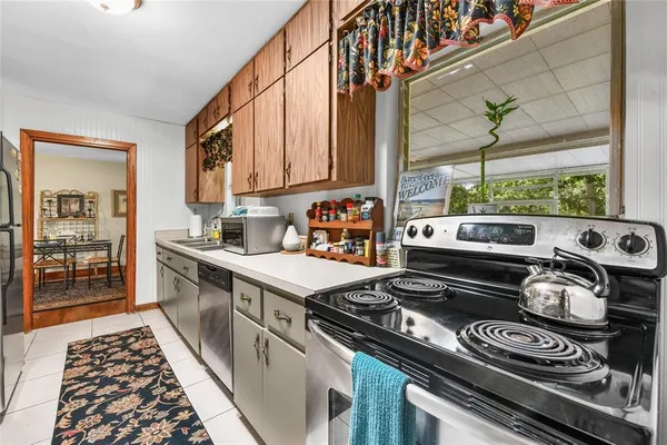 a kitchen with a stove and a microwave