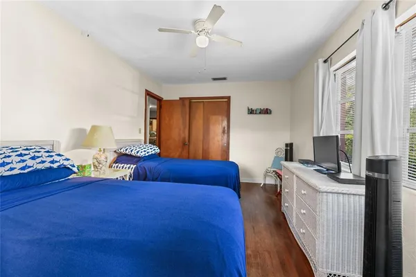 a bedroom with bed and window