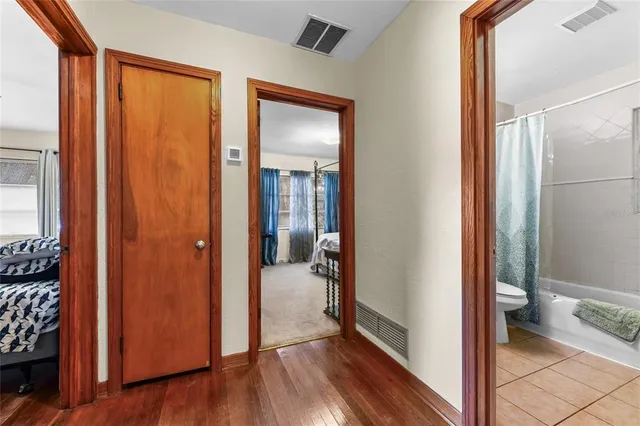 a view of a bathroom from a hallway