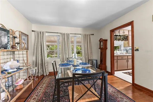 a view of a dining room with furniture window and outside view