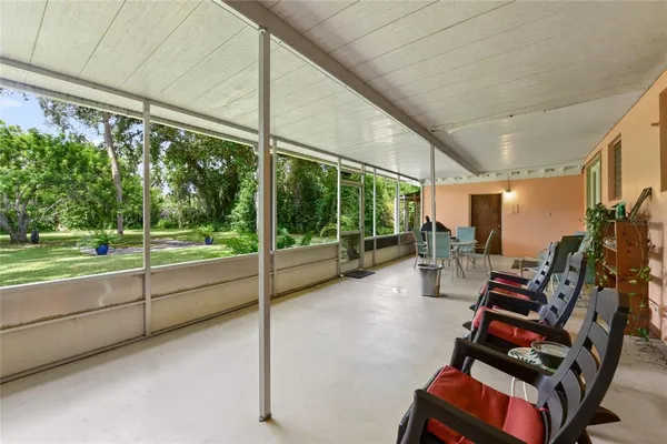 a room with gym equipment and large windows