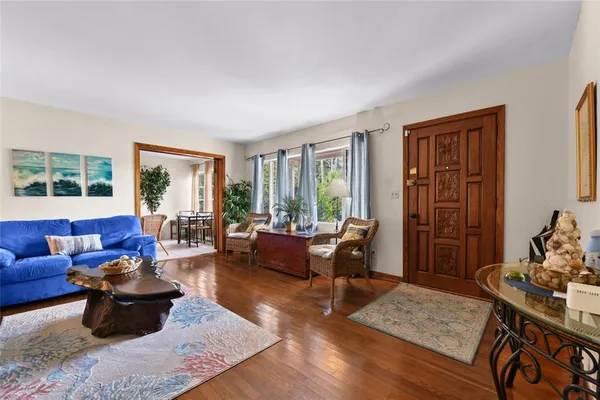 a living room with furniture or couch and a potted plant