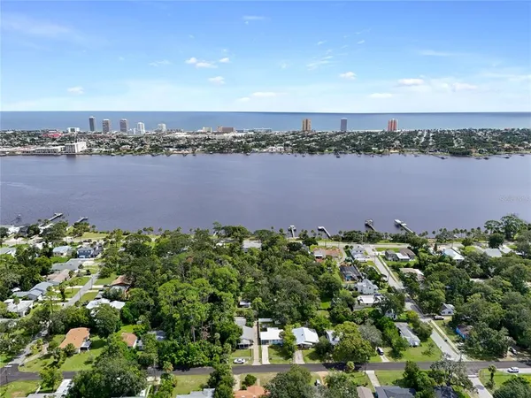 a view of a lake with houses in the back