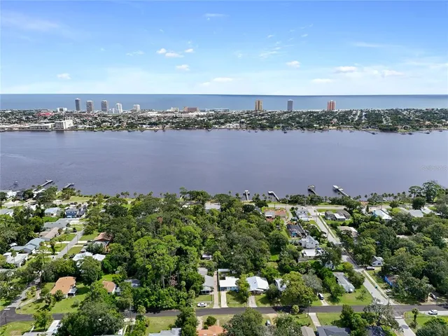 a view of a lake with houses in the back