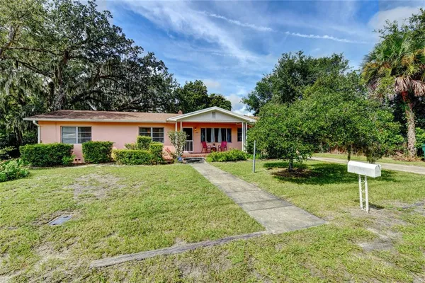 a front view of a house with yard